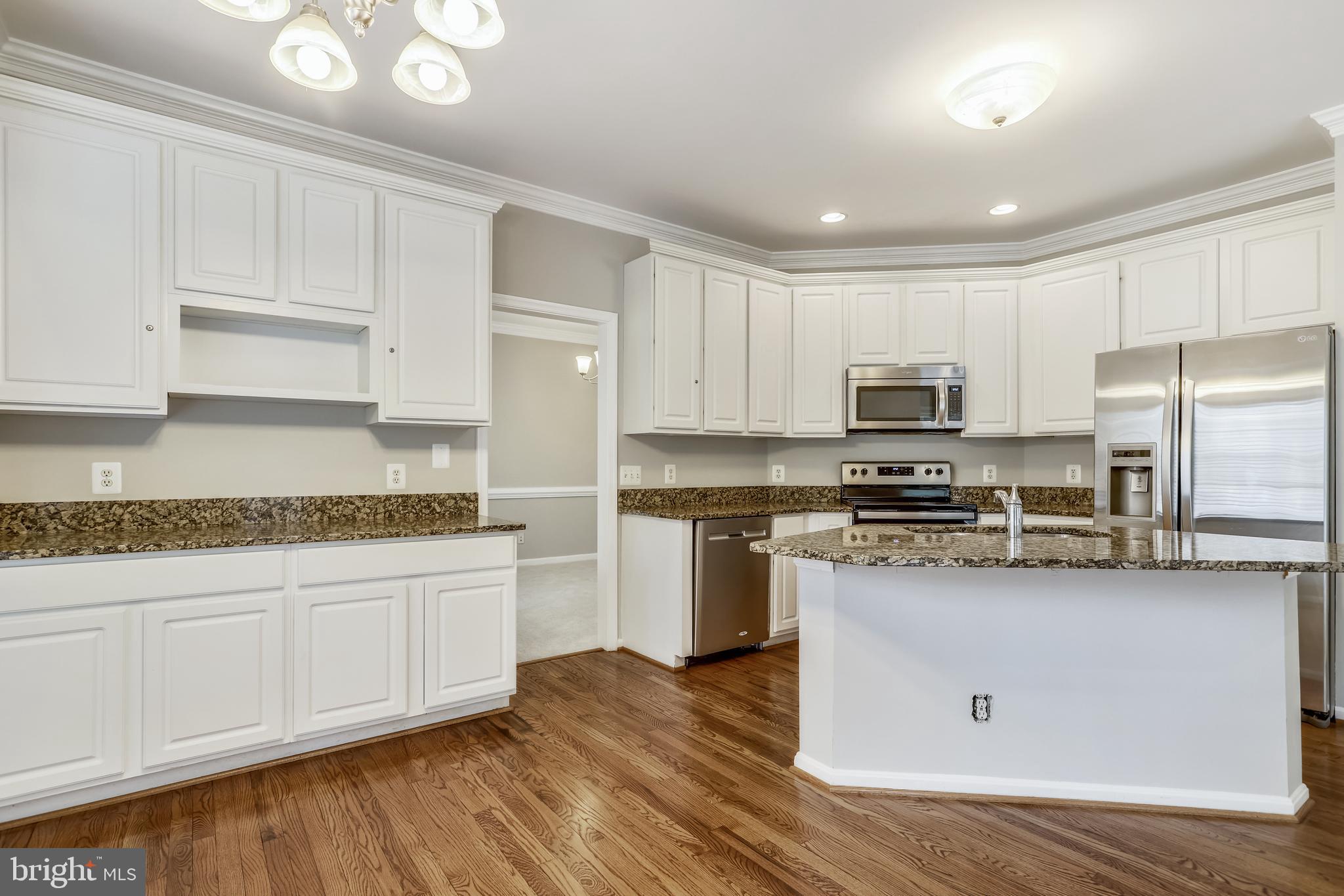16 Sunset Ridge Lane Fredericksburg, VA 22405 - Photo 11 of 35 a kitchen with stainless steel appliances granite countertop a stove a sink and white cabinets