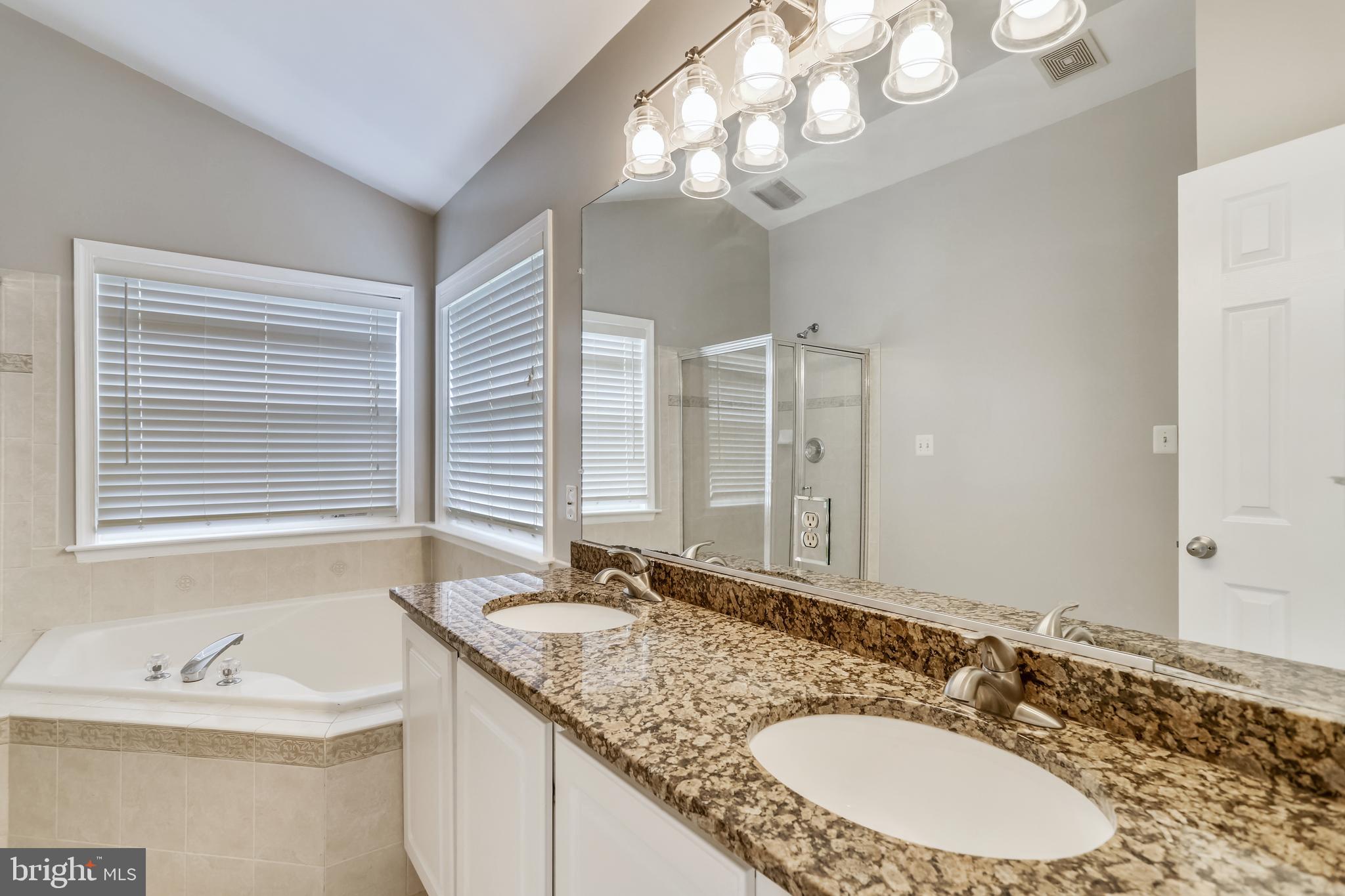 16 Sunset Ridge Lane Fredericksburg, VA 22405 - Photo 18 of 35 a bathroom with a granite countertop sink and a mirror