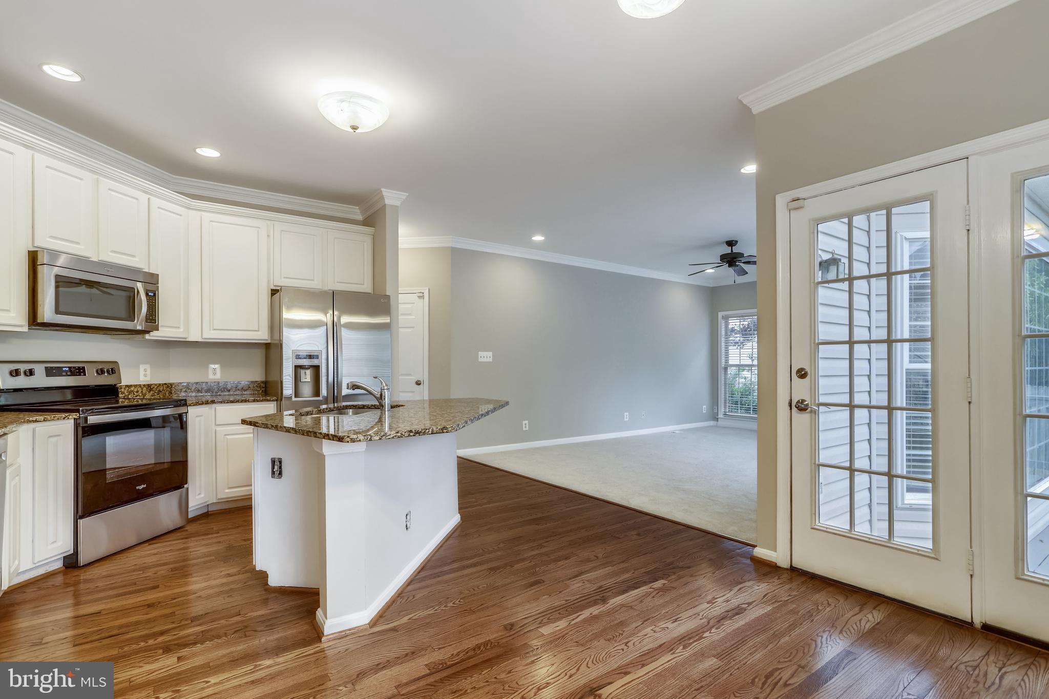 16 Sunset Ridge Lane Fredericksburg, VA 22405 - Photo 7 of 35 a large kitchen with granite countertop a stove and a sink