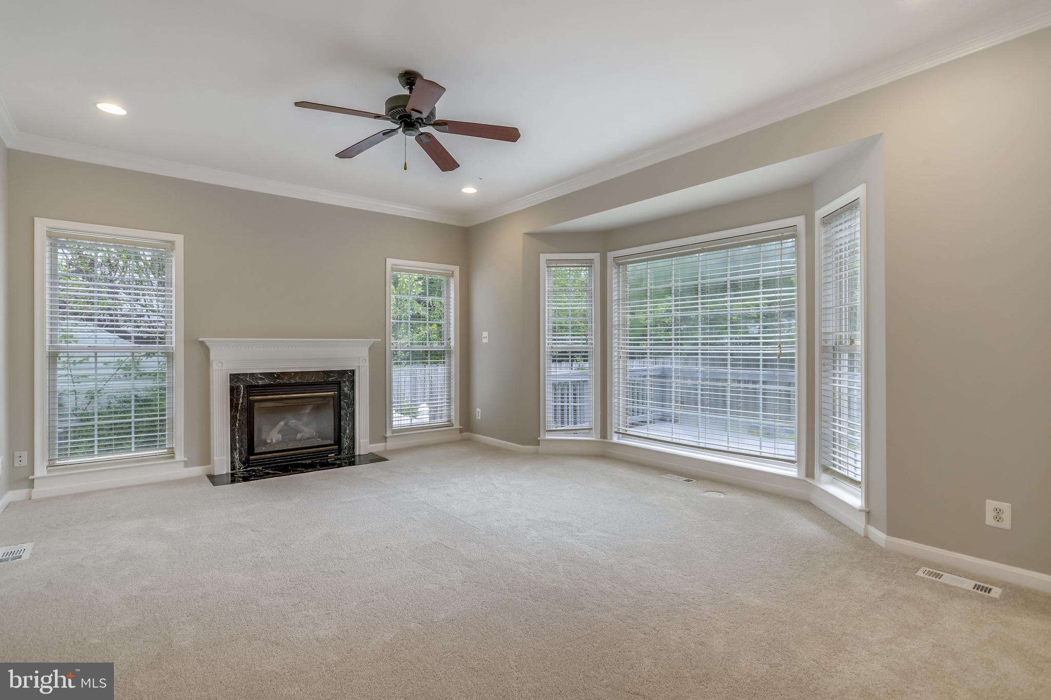 16 Sunset Ridge Lane Fredericksburg, VA 22405 - Photo 8 of 35 a view of an empty room with a fireplace and a window