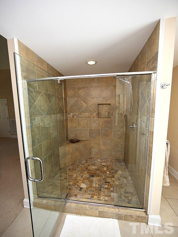 1315 Chaney Road Raleigh, NC 27606 - Photo 14 of 25 It's huge with beautiful tile work!