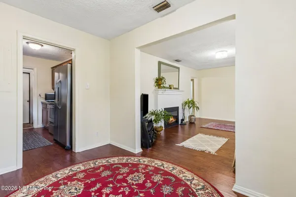 a living room with furniture and a rug