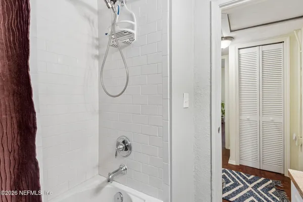 a bathroom with a glass shower door
