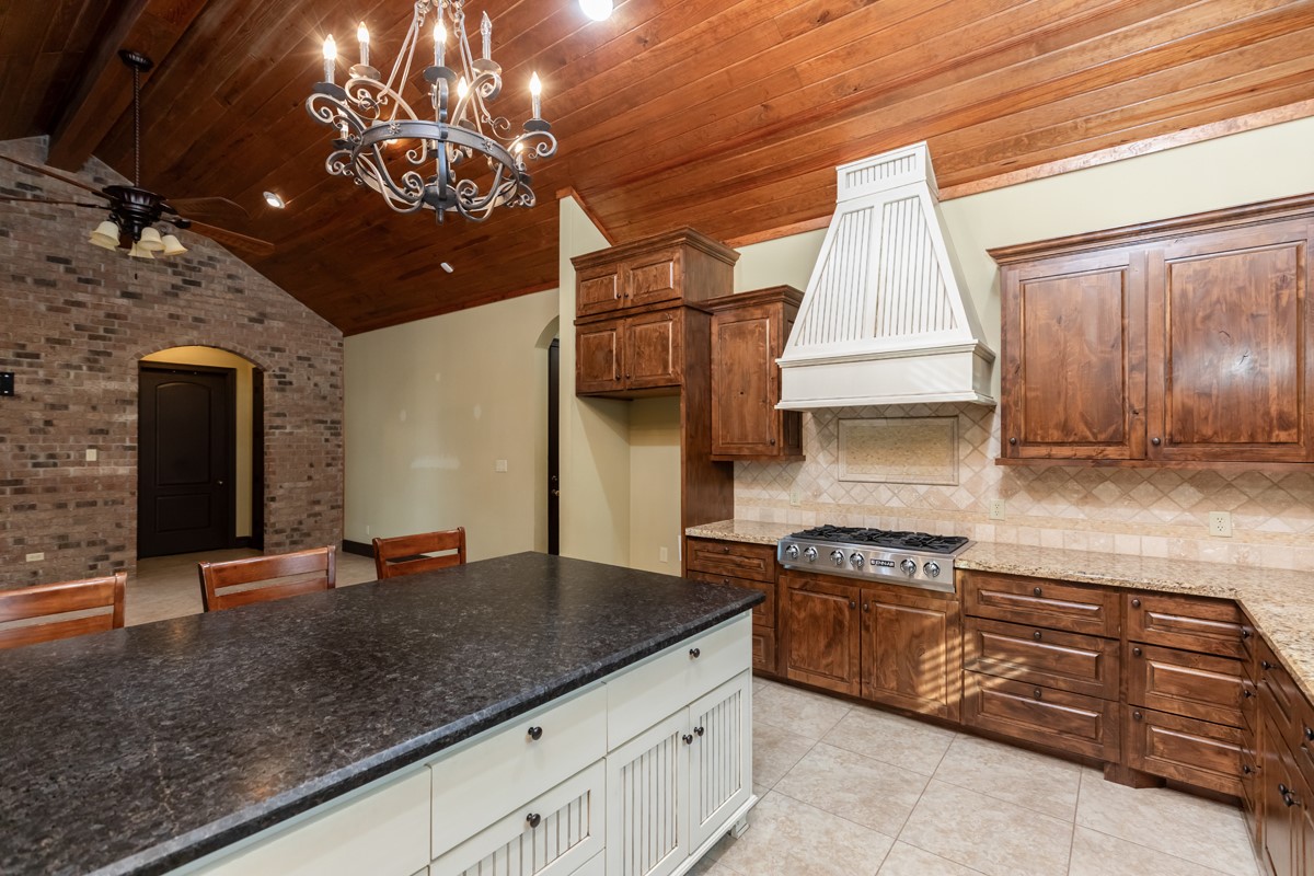 3365 Esplanade Beaumont, TX 77707 - Photo 13 of 33 a kitchen with a sink and cabinets