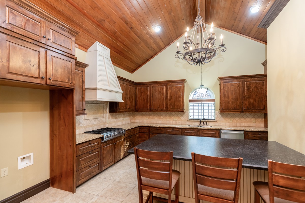 3365 Esplanade Beaumont, TX 77707 - Photo 17 of 33 a kitchen with a refrigerator a stove a sink and cabinets