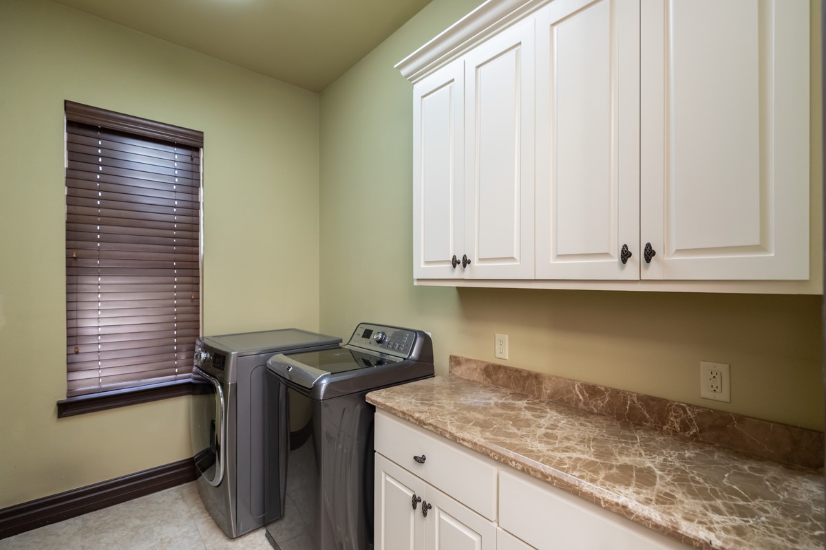 3365 Esplanade Beaumont, TX 77707 - Photo 21 of 33 a kitchen with granite countertop white cabinets and a sink