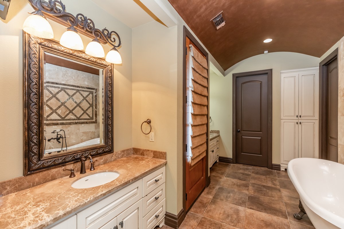 3365 Esplanade Beaumont, TX 77707 - Photo 24 of 33 a bathroom with a granite countertop sink mirror vanity and toilet