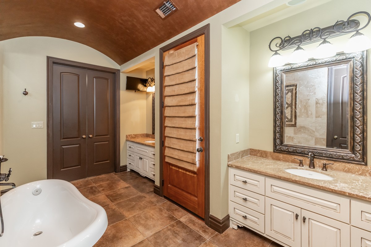 3365 Esplanade Beaumont, TX 77707 - Photo 26 of 33 a bathroom with a sink double vanity and a large mirror