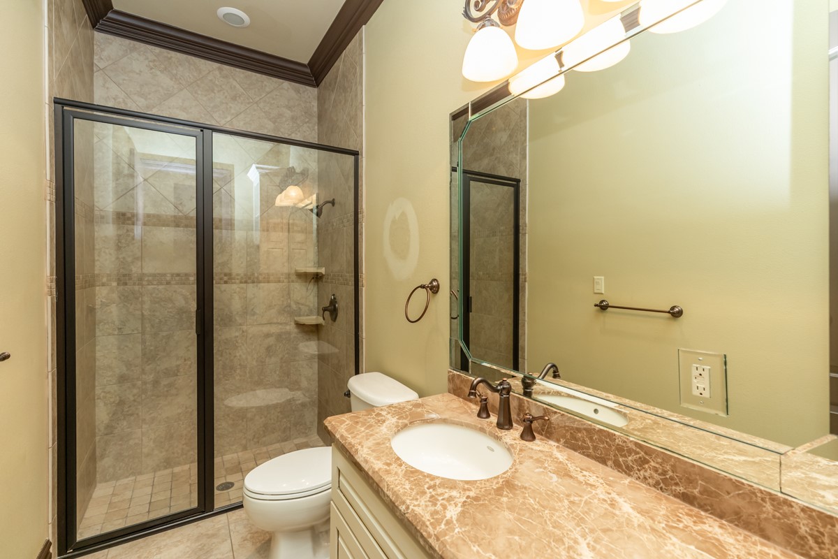3365 Esplanade Beaumont, TX 77707 - Photo 30 of 33 a bathroom with a granite countertop sink toilet and shower