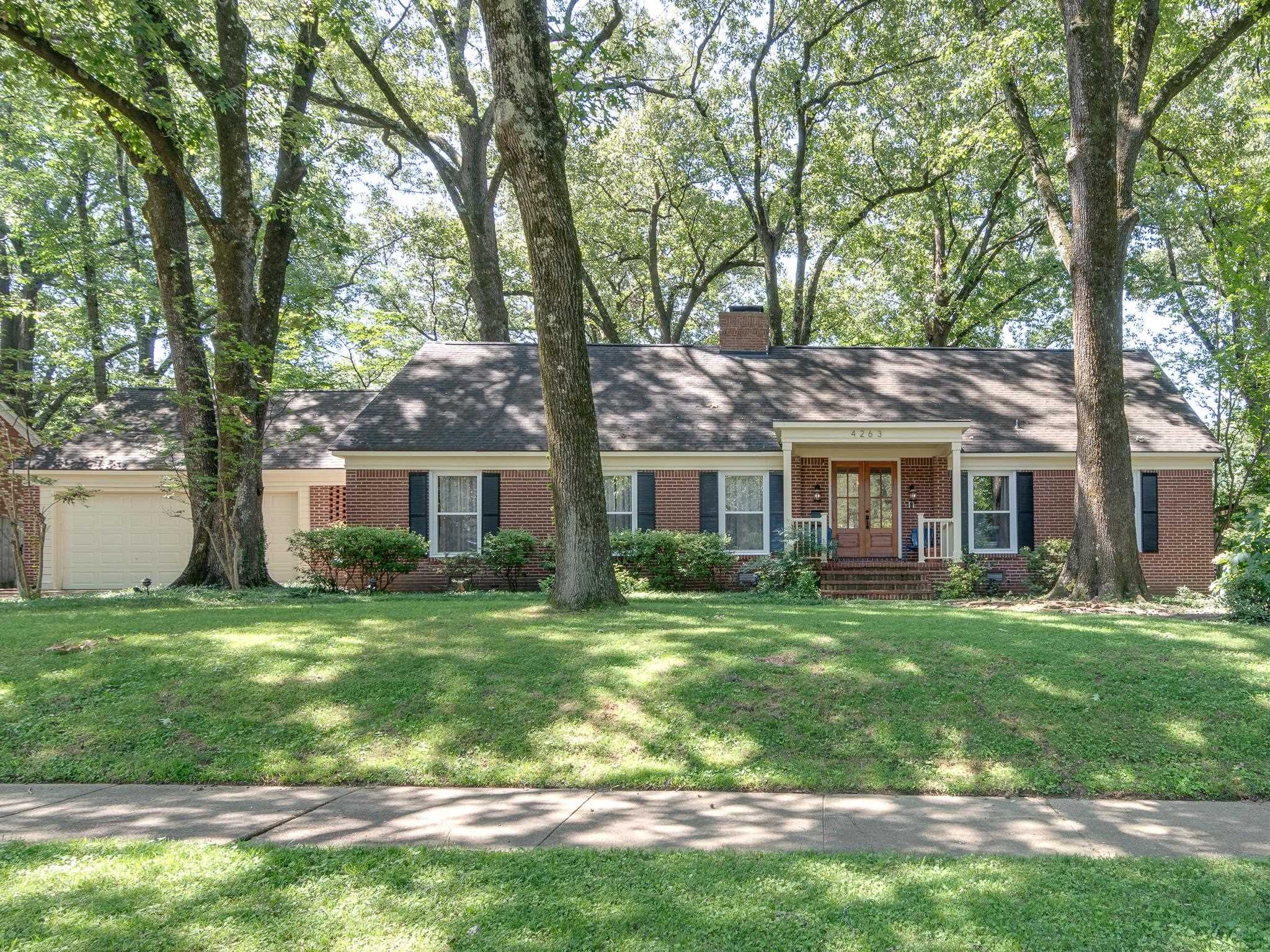 4263 Burgundy Road Memphis, TN 38111 - Photo 1 of 38 New custom wooden doors welcome you into this beautifully cared for home in the heart of East Memphis.