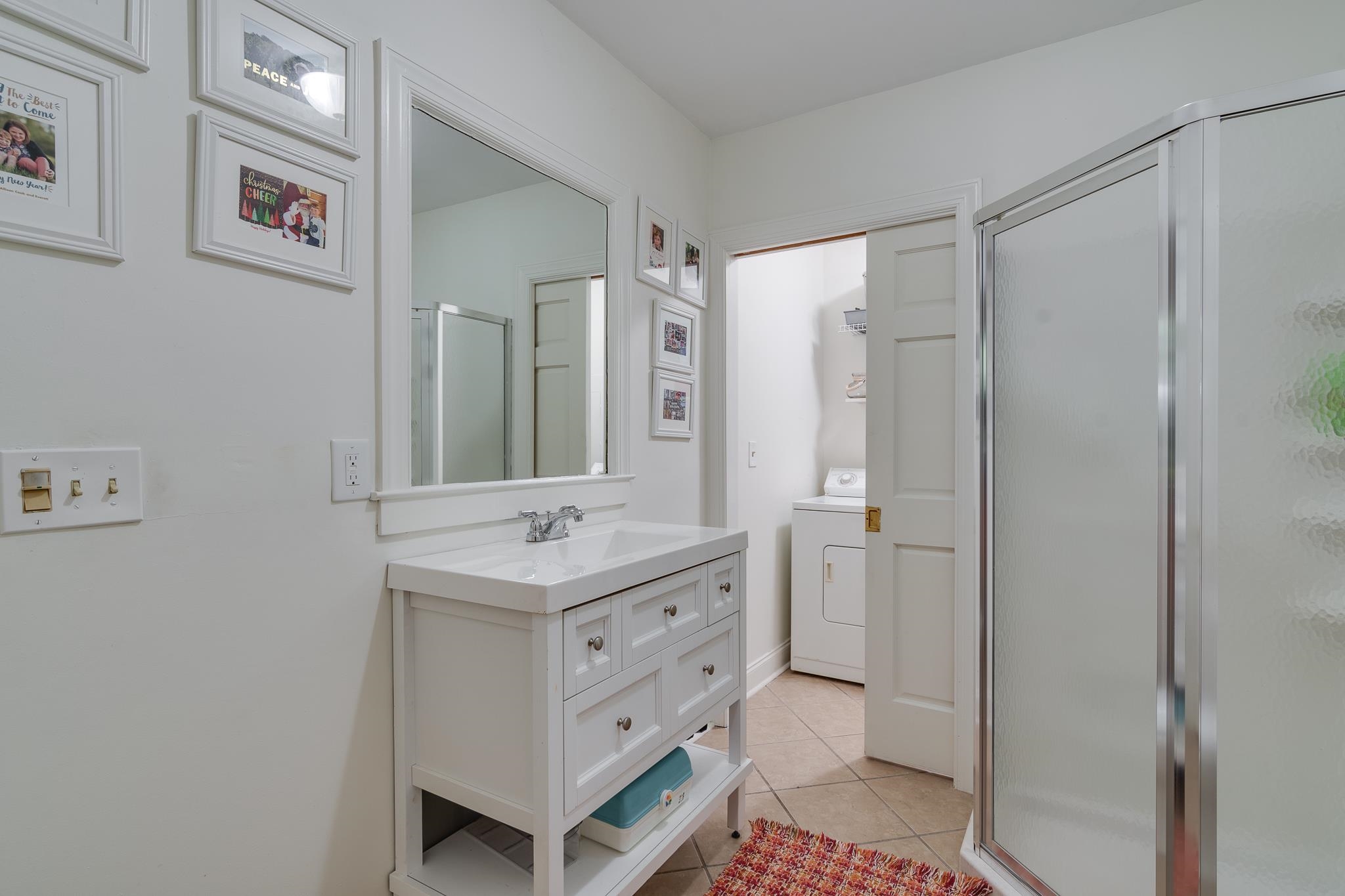 4263 Burgundy Road Memphis, TN 38111 - Photo 27 of 38 Bathroom #3 near the door to the garage has tile floors, a shower and is attached to the laundry room.