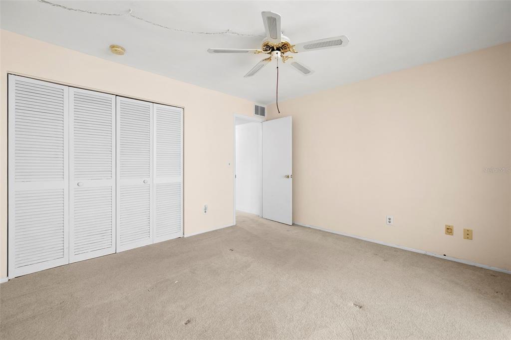 400 Glennes Lane, Unit 206 Dunedin, FL 34698 - Photo 18 of 49 a view of an empty room