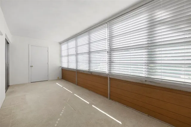 a view of a room with a large window