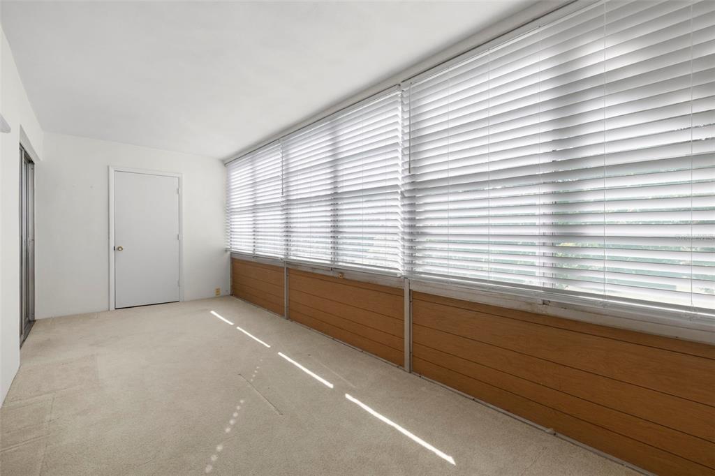 400 Glennes Lane, Unit 206 Dunedin, FL 34698 - Photo 19 of 49 a view of a room with a large window