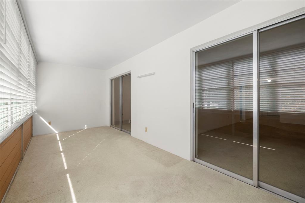 400 Glennes Lane, Unit 206 Dunedin, FL 34698 - Photo 20 of 49 a view of an empty room with a window