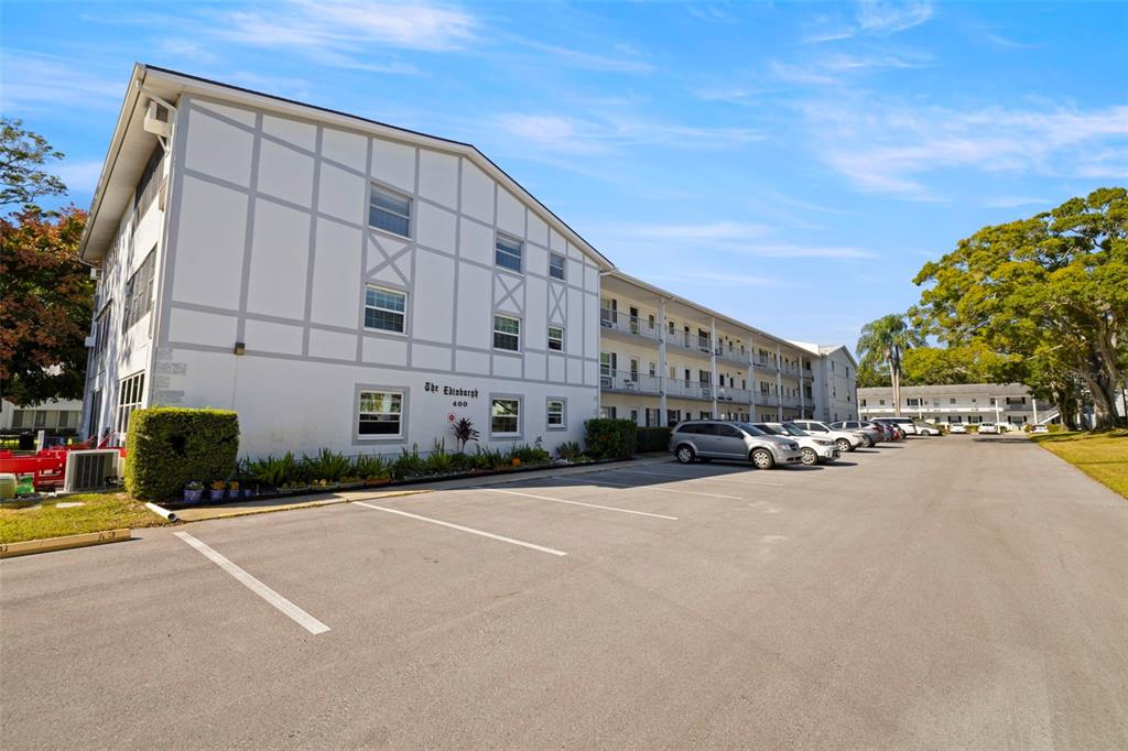 400 Glennes Lane, Unit 206 Dunedin, FL 34698 - Photo 2 of 49 a view of a street with a building in the background