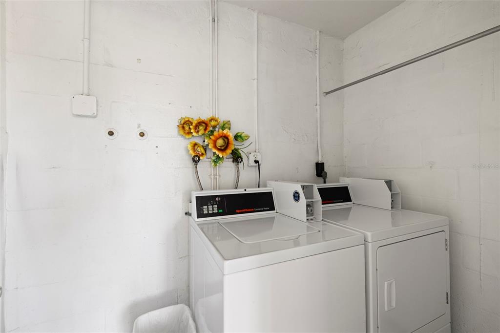 400 Glennes Lane, Unit 206 Dunedin, FL 34698 - Photo 22 of 49 a utility room with dryer and washer