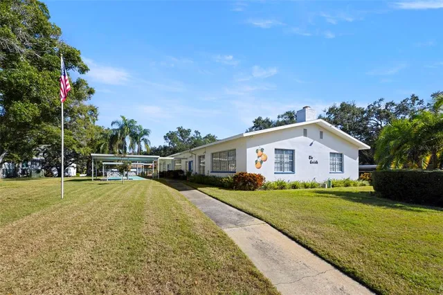 a swimming pool with an outdoor seating