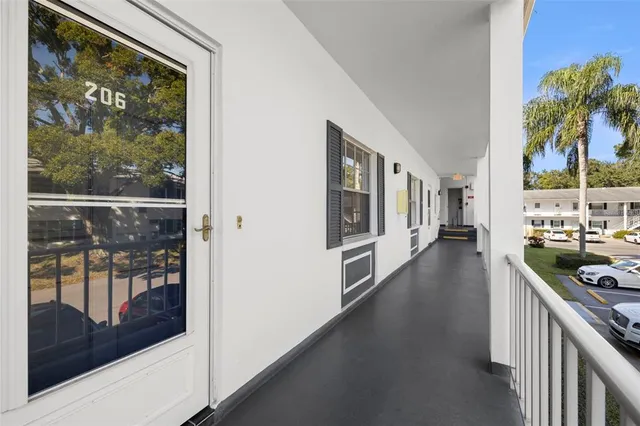 a outdoor space with lots of furniture and view of living room