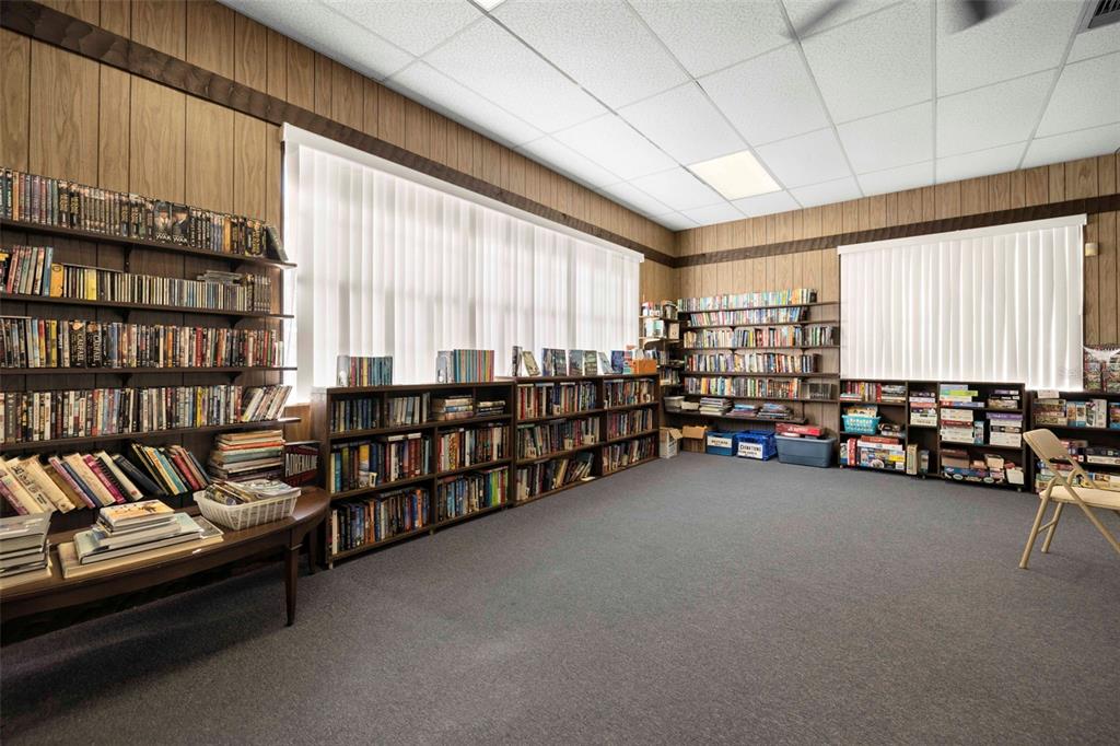 400 Glennes Lane, Unit 206 Dunedin, FL 34698 - Photo 28 of 49 a room with lots of furniture and white walls