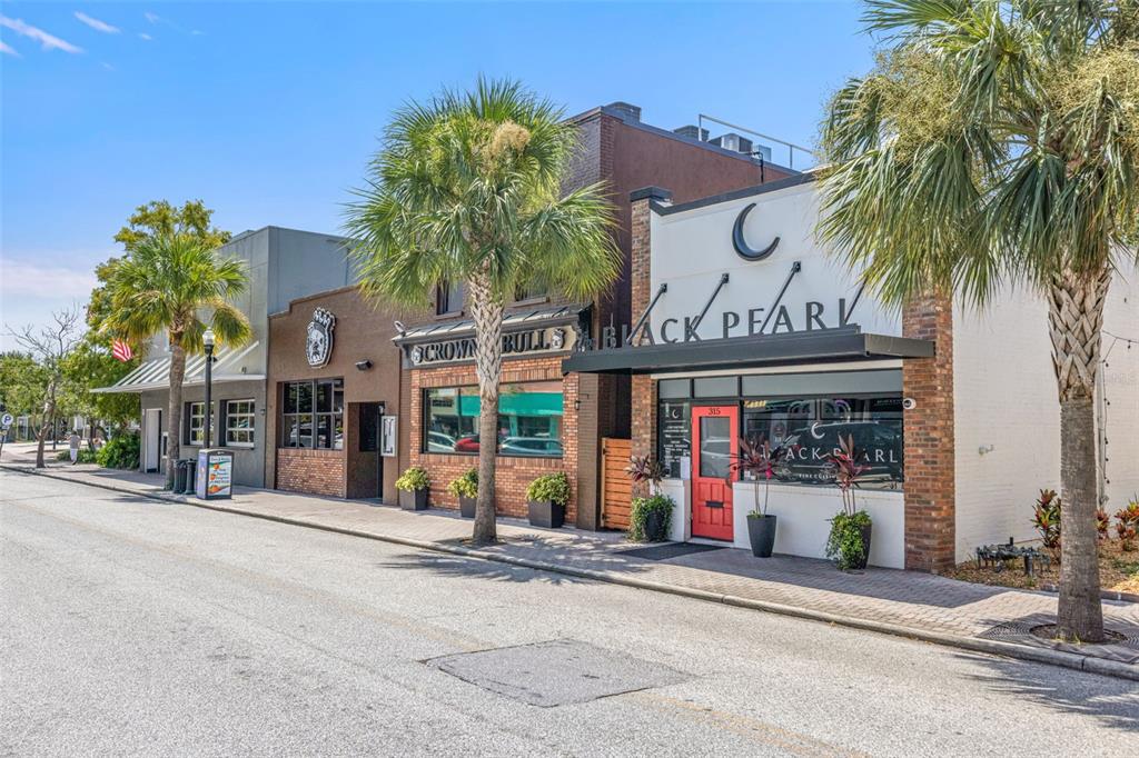 400 Glennes Lane, Unit 206 Dunedin, FL 34698 - Photo 34 of 49 a view of a street with stores
