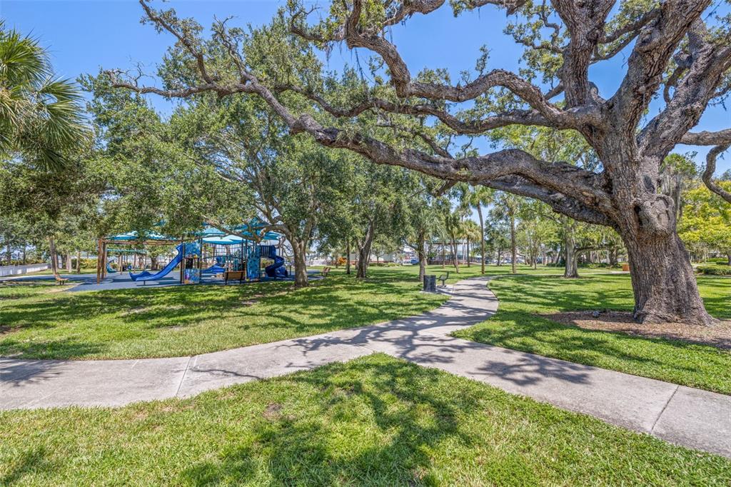 400 Glennes Lane, Unit 206 Dunedin, FL 34698 - Photo 37 of 49 a front view of a house with a yard