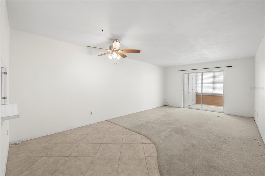 400 Glennes Lane, Unit 206 Dunedin, FL 34698 - Photo 4 of 49 a view of an empty room with a window