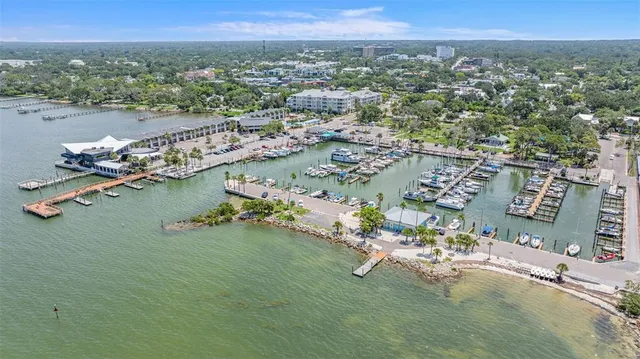an aerial view of a houses with a parking space