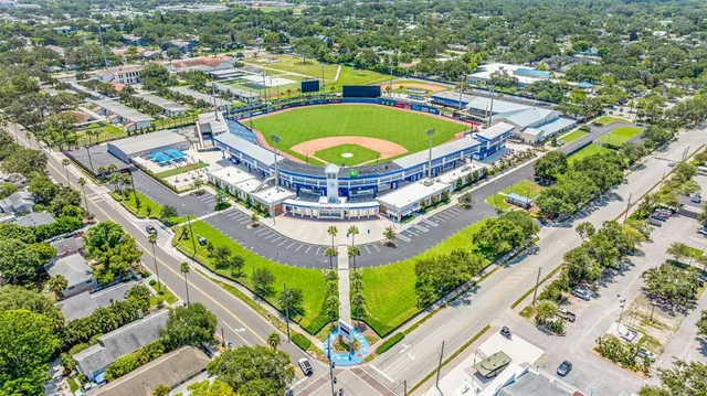 an aerial view of residential building with outdoor space and lake view