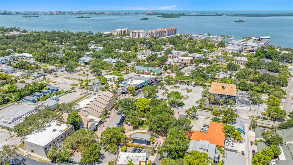 400 Glennes Lane, Unit 206 Dunedin, FL 34698 - Photo 45 of 49 an aerial view of residential building with outdoor space and lake view