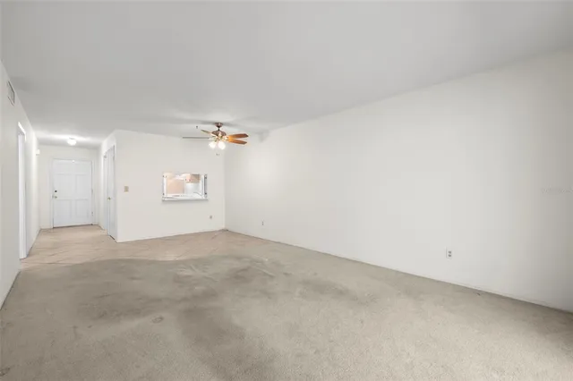 a view of a big room with carpet