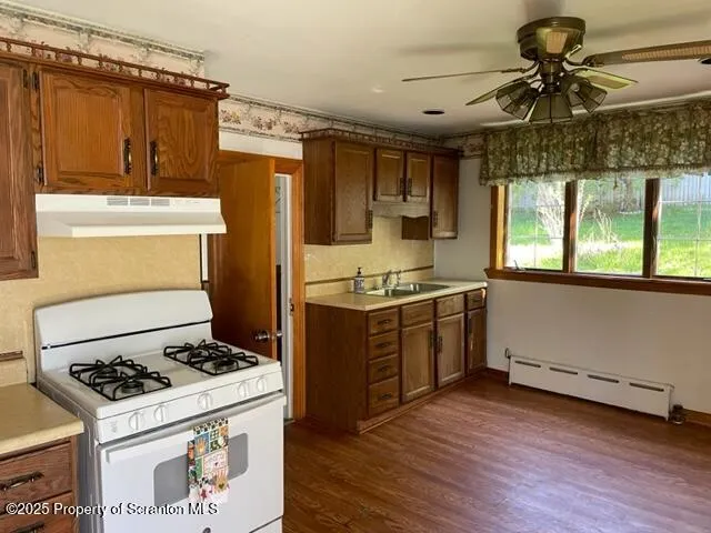 a kitchen with a stove and a refrigerator