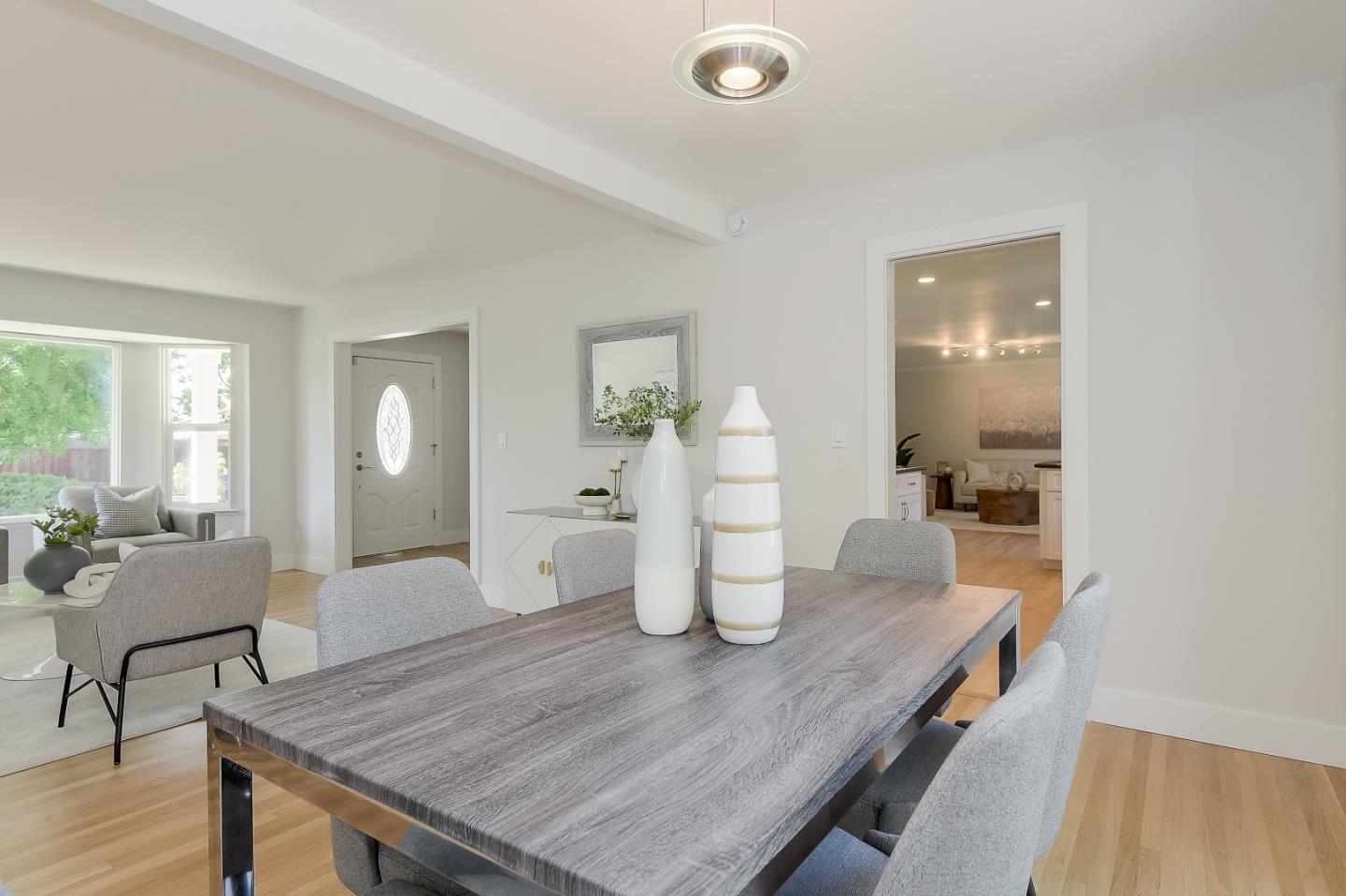 632 Smoke Tree Way Sunnyvale, CA 94086 - Photo 12 of 38 a dining room with wooden floor and furniture