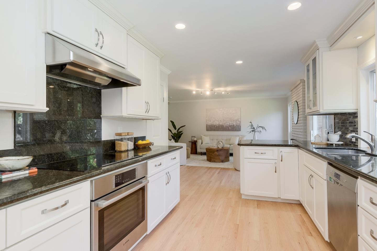 632 Smoke Tree Way Sunnyvale, CA 94086 - Photo 13 of 38 a kitchen with stainless steel appliances granite countertop a sink stove and cabinets