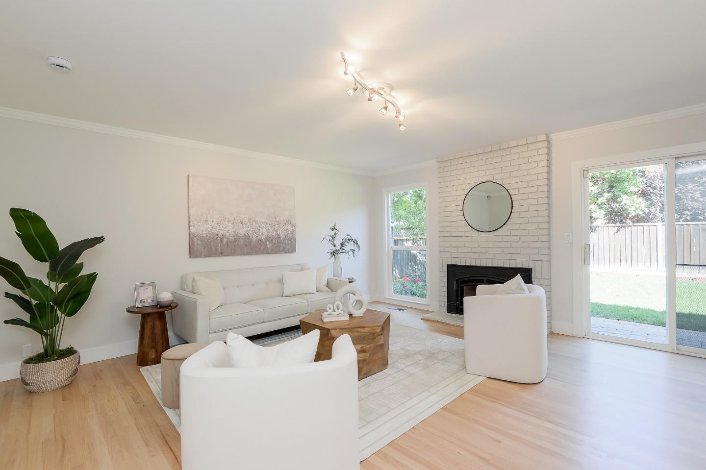 632 Smoke Tree Way Sunnyvale, CA 94086 - Photo 16 of 38 a living room with furniture a fireplace and potted plants