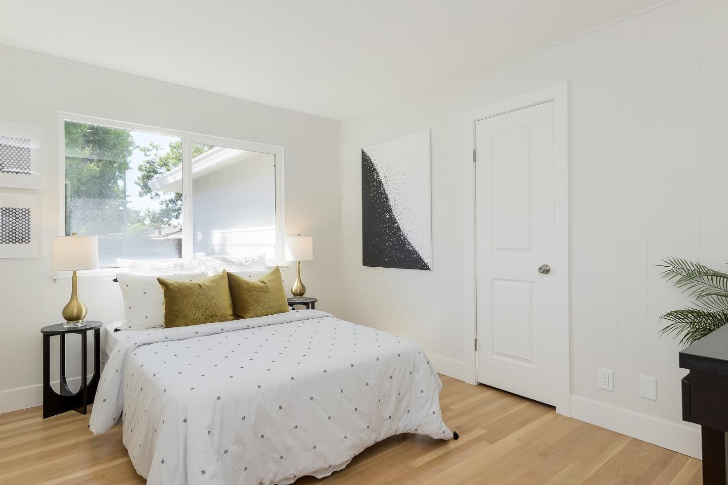 632 Smoke Tree Way Sunnyvale, CA 94086 - Photo 21 of 38 a bedroom with a bed and wooden floor