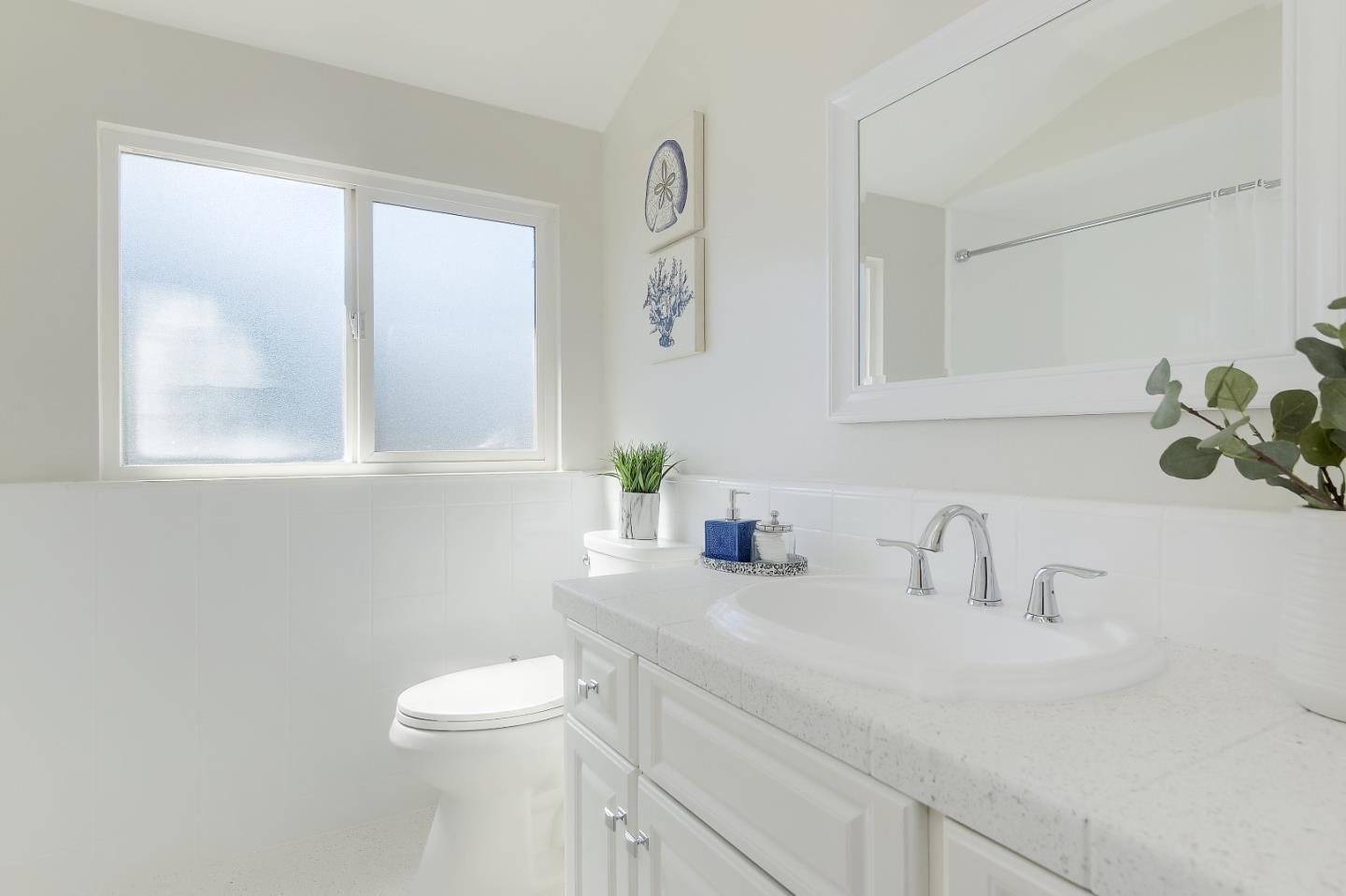 632 Smoke Tree Way Sunnyvale, CA 94086 - Photo 25 of 38 a bathroom with a sink a toilet and a mirror