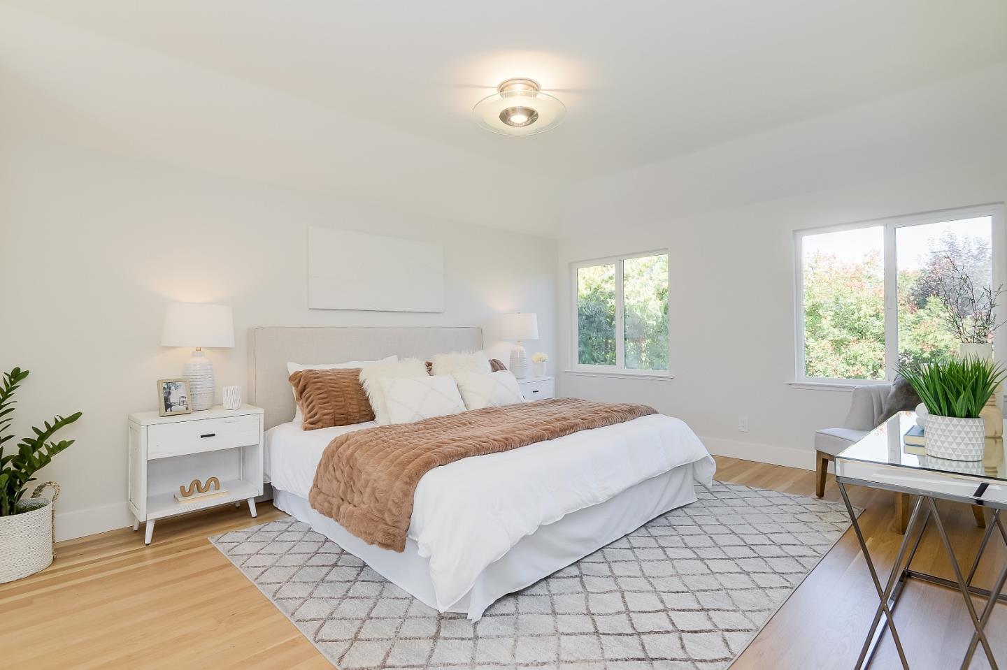 632 Smoke Tree Way Sunnyvale, CA 94086 - Photo 28 of 38 a bedroom with a bed and a table in it with window