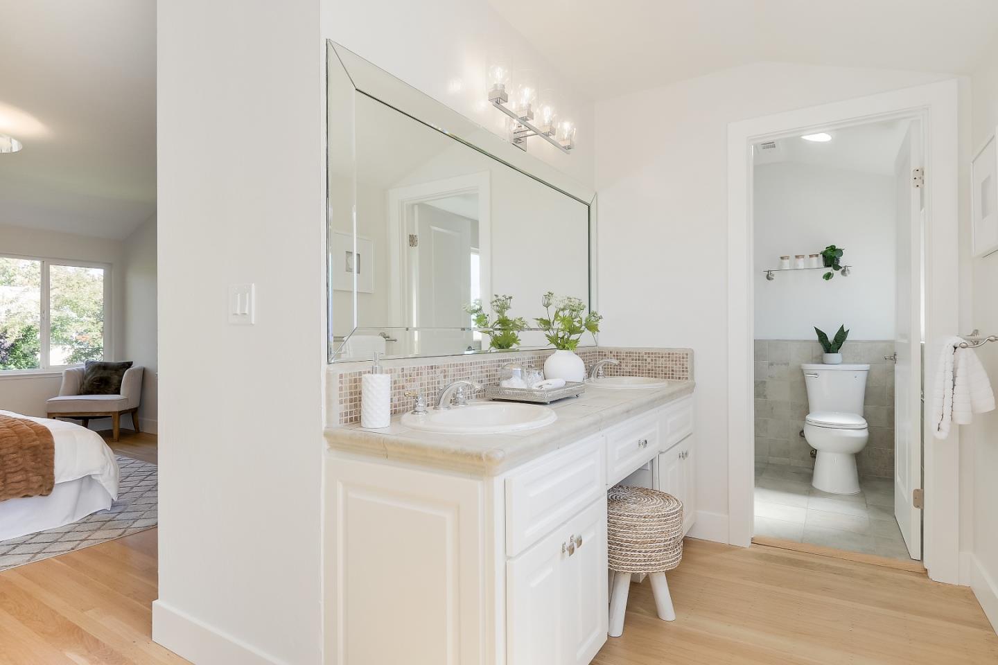 632 Smoke Tree Way Sunnyvale, CA 94086 - Photo 30 of 38 a spacious bathroom with a granite countertop sink and a mirror