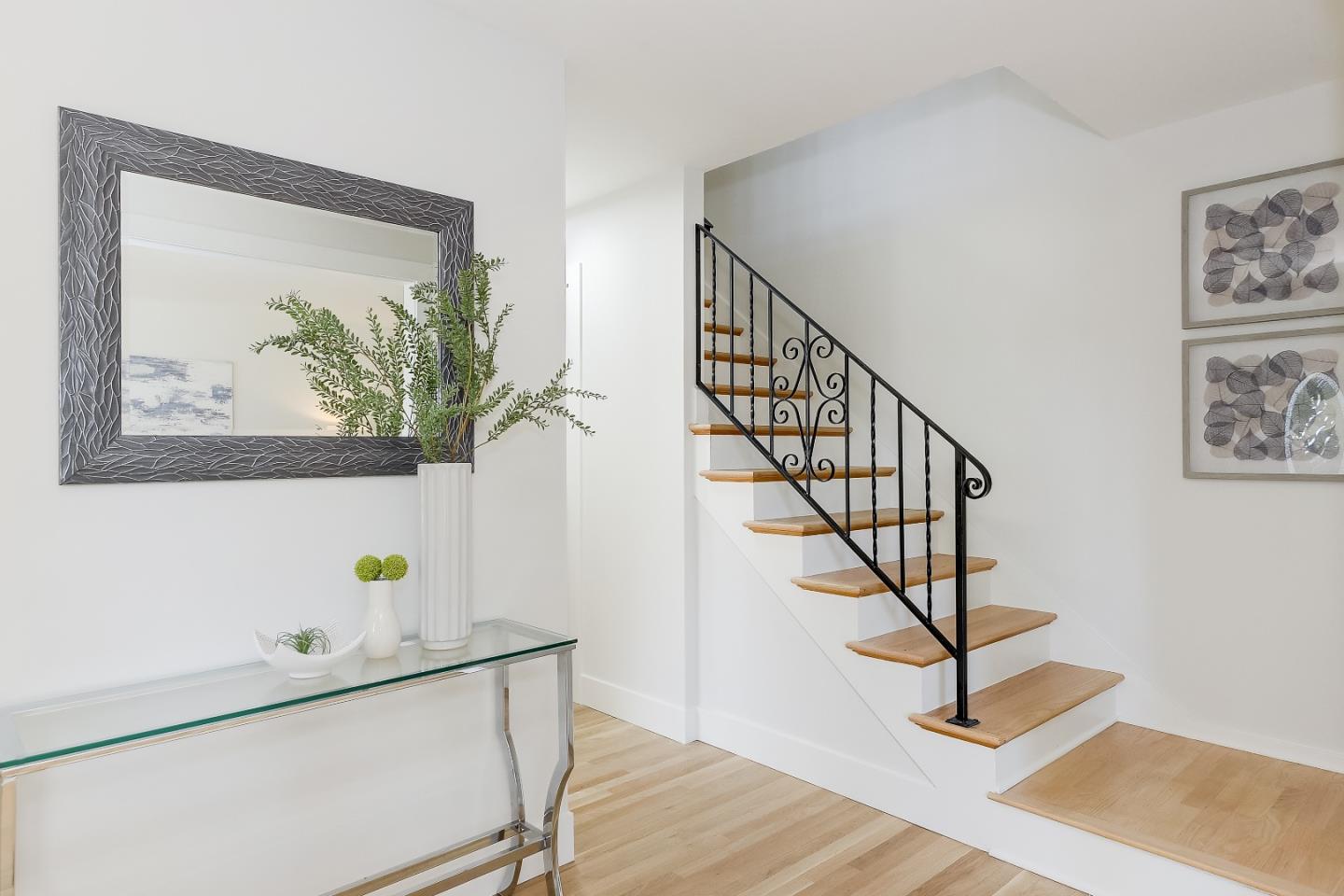632 Smoke Tree Way Sunnyvale, CA 94086 - Photo 7 of 38 a view of staircase with wooden floor and a potted plant