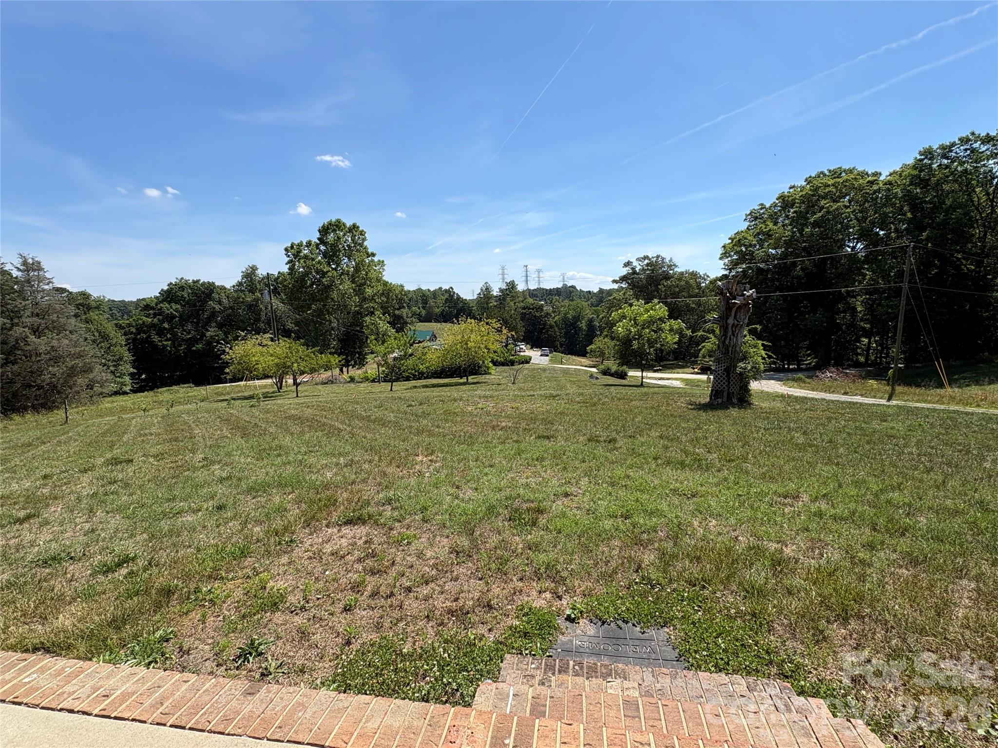 4855 Talley Road Walkertown, NC 27051 - Photo 6 of 45 a big yard with lots of green space and trampoline