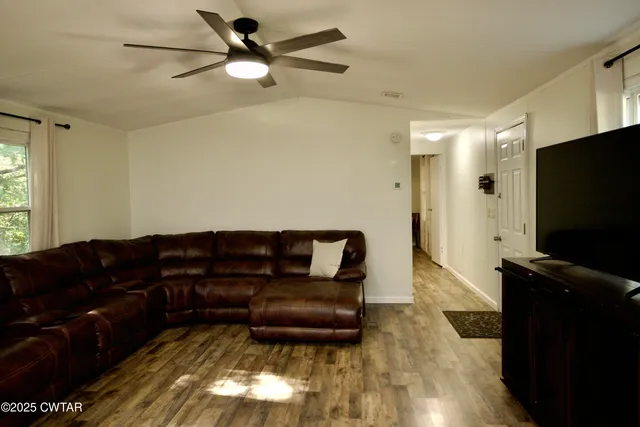a living room with a couch and a flat screen tv