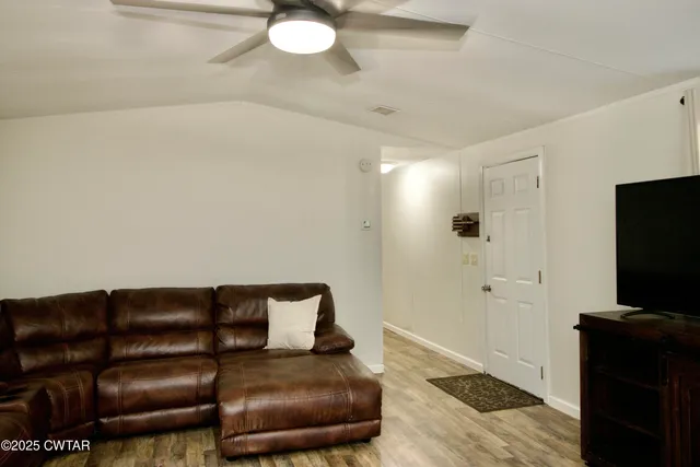 a living room with furniture and a window