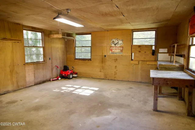 a swimming pool with outdoor seating and yard