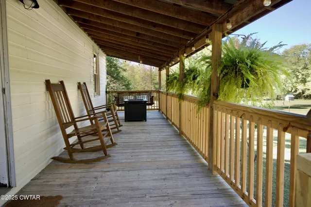 a kitchen with a table chairs sink and cabinets