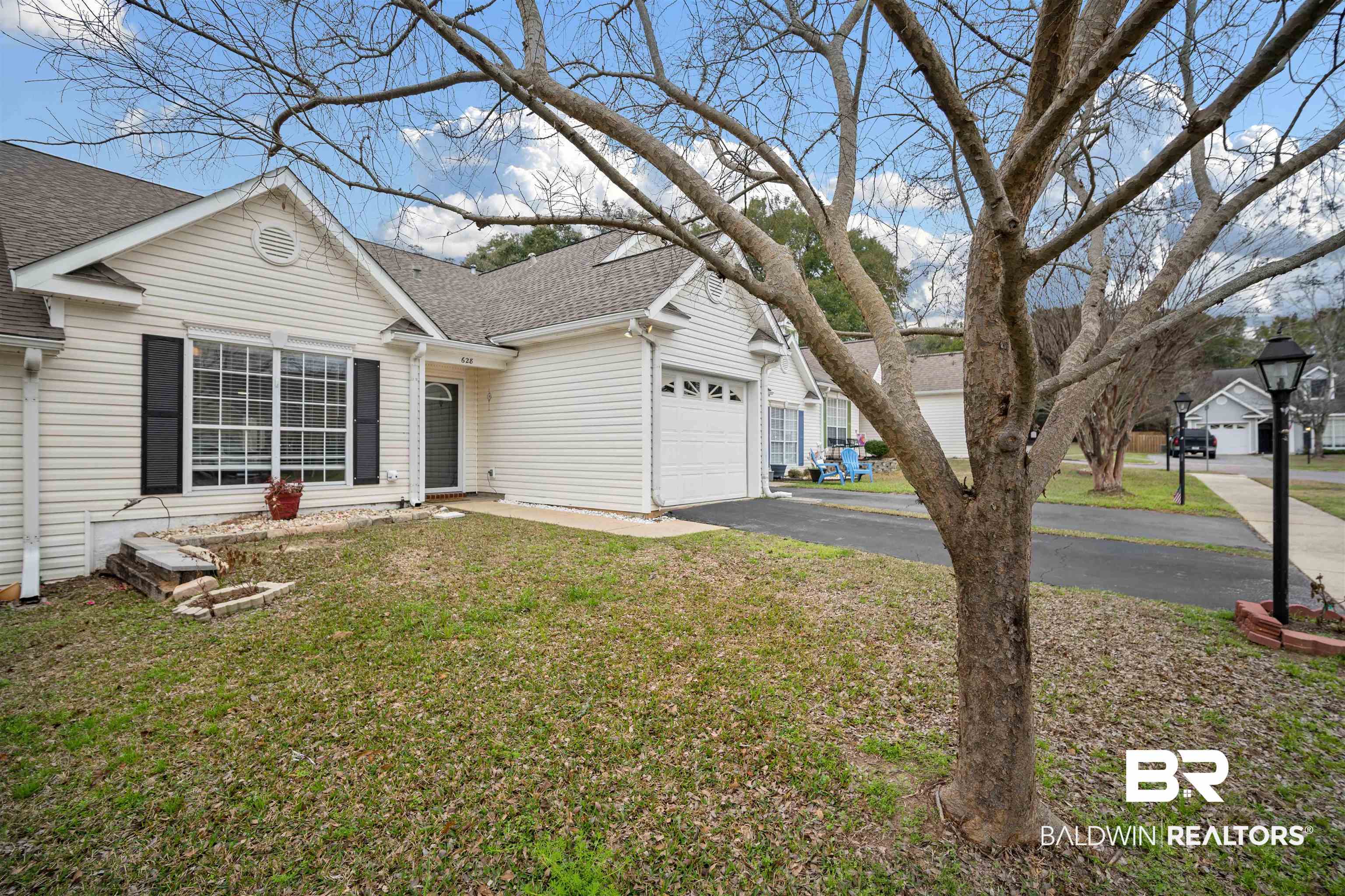 628 Spring Lake Court Mobile, AL 36695 - Photo 3 of 25 View of front facade featuring a garage and a front yard