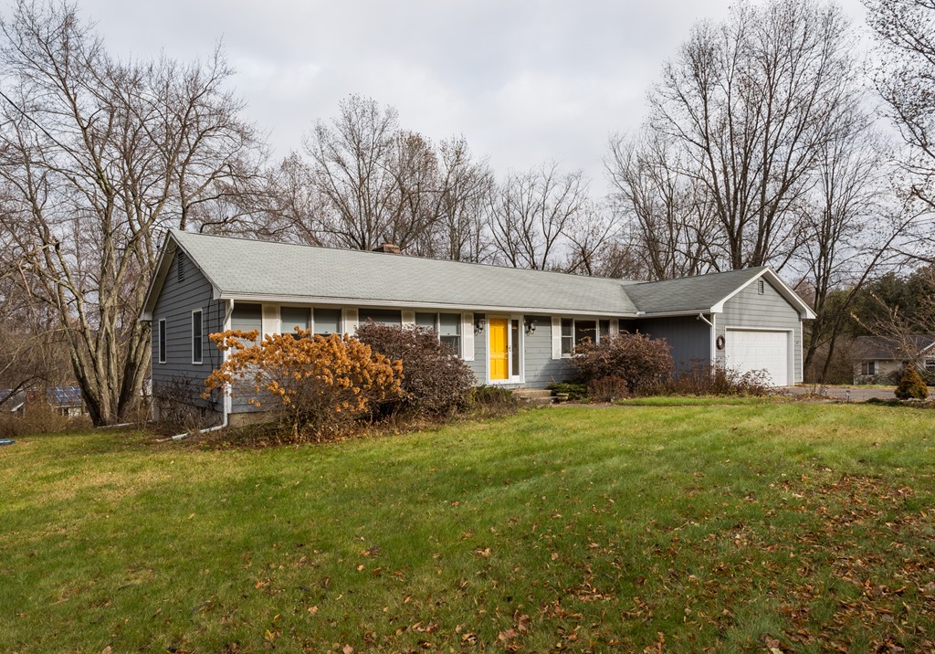 1174 Bay Road Amherst, MA 01002 - Photo 1 of 30 a front view of a house with a yard