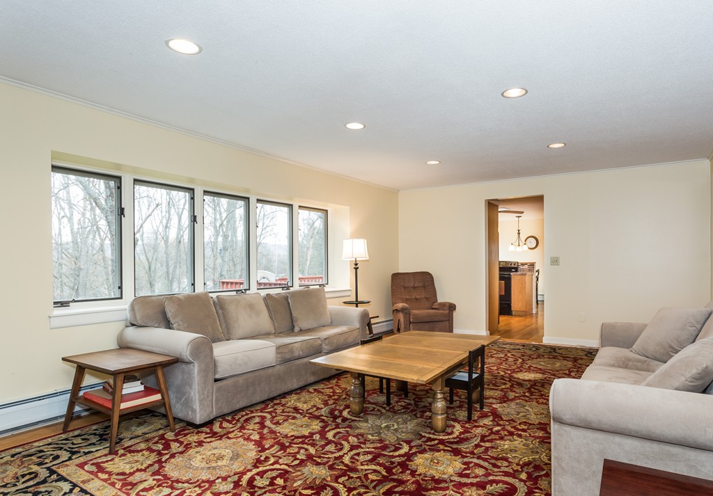 1174 Bay Road Amherst, MA 01002 - Photo 7 of 30 a living room with furniture and a large window