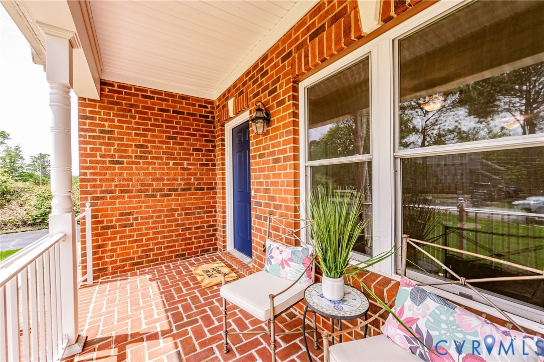 2018 Valentine Road Henrico, VA 23228 - Photo 10 of 65 a view of a balcony with chair and a potted plant