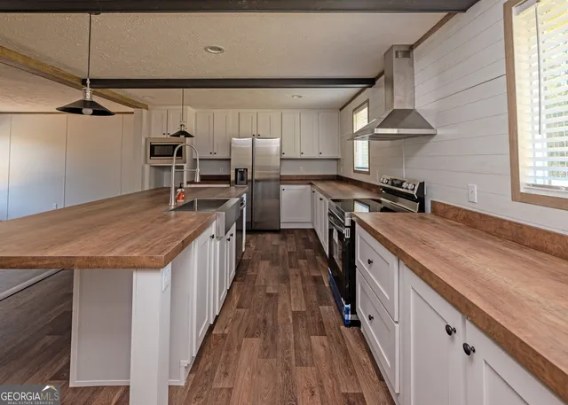 a kitchen with a stove and a sink